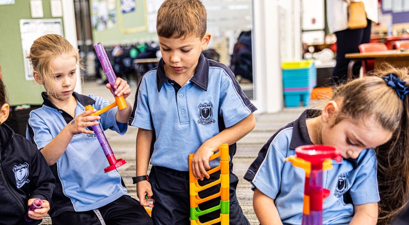 Children playing with equipment at St Madeleine's Catholic Primary School Kenthurst