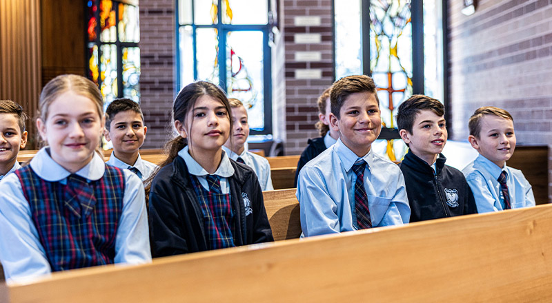 Children sitting in church from St Madeleine's Catholic Primary School Kenthurst