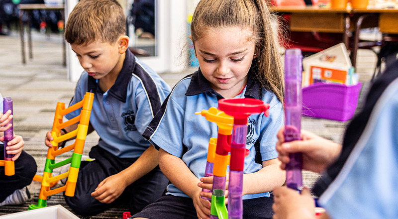 Students playing with equipment at St Madeleine's Catholic Primary School Kenthurst
