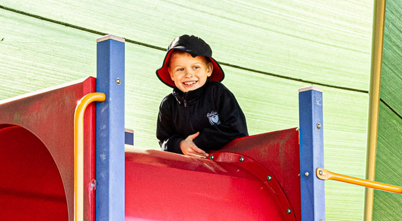 Student on play equipment at St Madeleine's Catholic Primary School Kenthurst