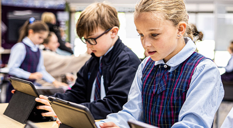 Students on laptops at St Madeleine's Catholic Primary School Kenthurst