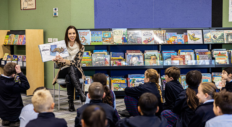 Teacher and students in library at St Madeleine's Catholic Primary School Kenthurst