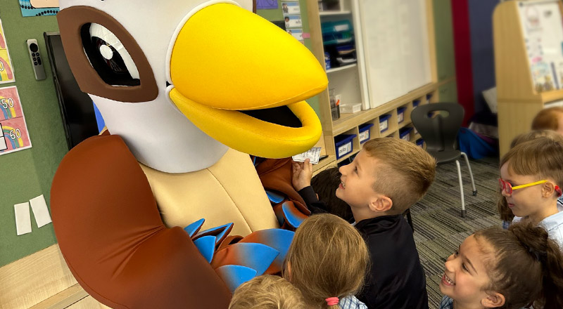 Wellbeing Mascot, Korra the Kookaburra, greets students at St Madeleine's Catholic Primary School Kenthurst