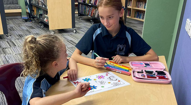 Year six student undergoes peer mentoring with kindergarten students at St Madeleine's Catholic Primary School Kenthurst