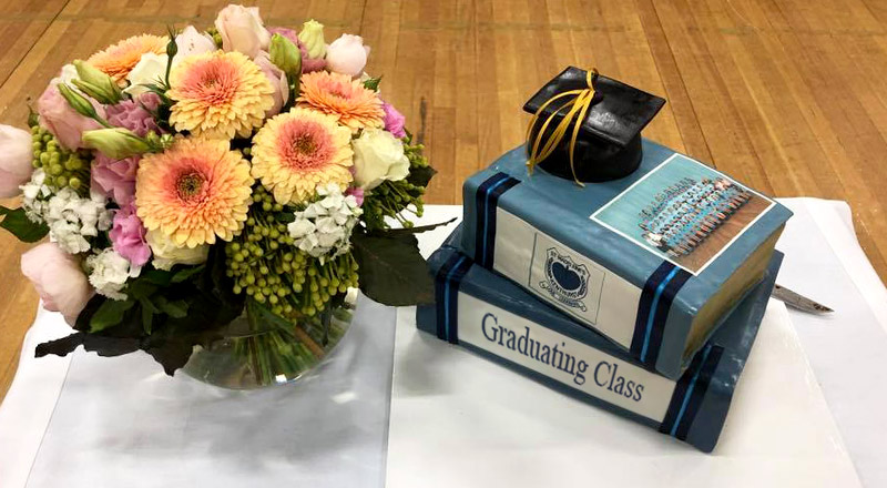 Blue cake celebrating graduation of students at St Madeleine's Catholic Primary School Kenthurst