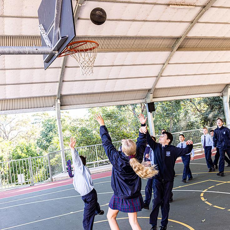 Students playing basketball at St Madeleine's Catholic Primary School Kenthurst