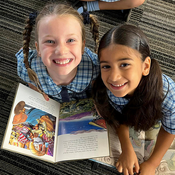 Children reading books at St Madeleine's Catholic Primary School Kenthurst