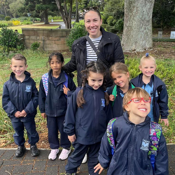Teacher with happy students at St Madeleine's Catholic Primary Kenthurst