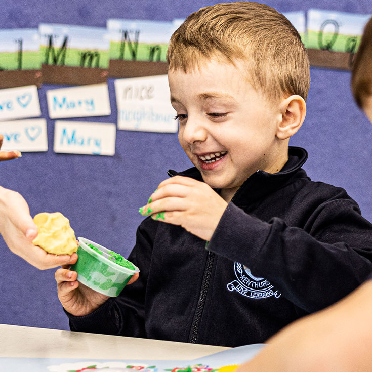 Student plays with playdo at St Madeleine's Catholic Primary School Kenthurst